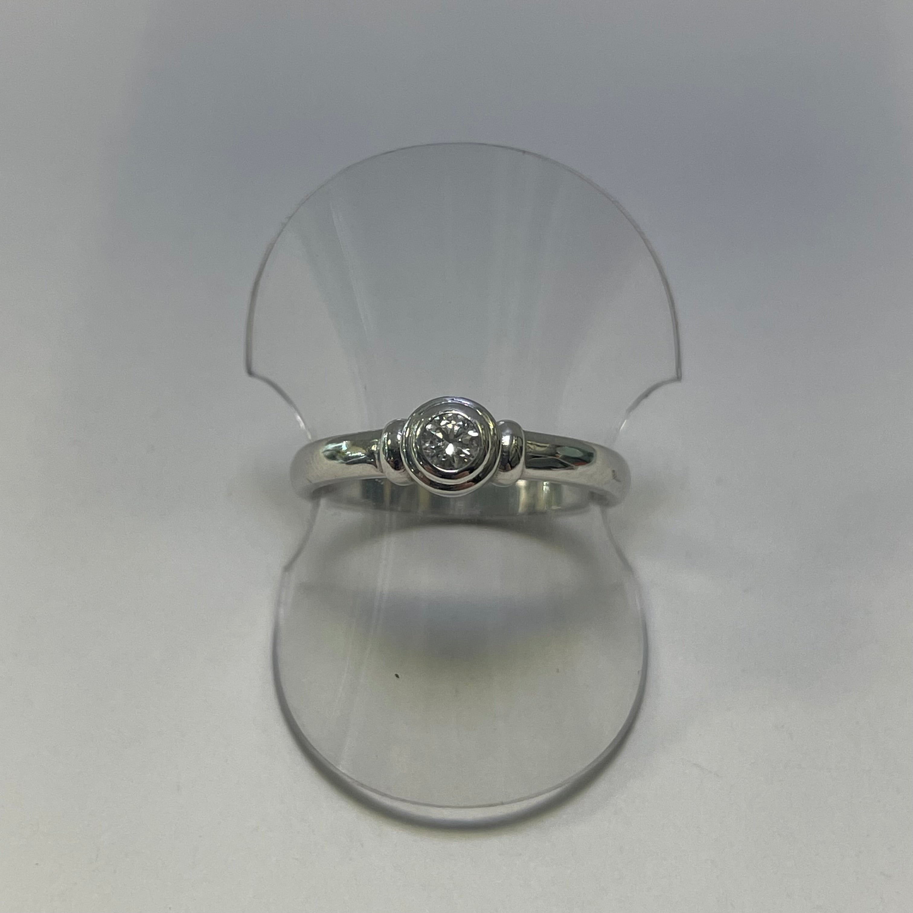 Rebecca 9ct White Gold 0.10ct Bezel Set Round Diamond Solitaire Engagement Ring (Size K)