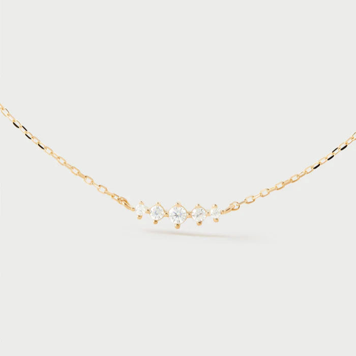 Gold necklace with small diamonds on a white background