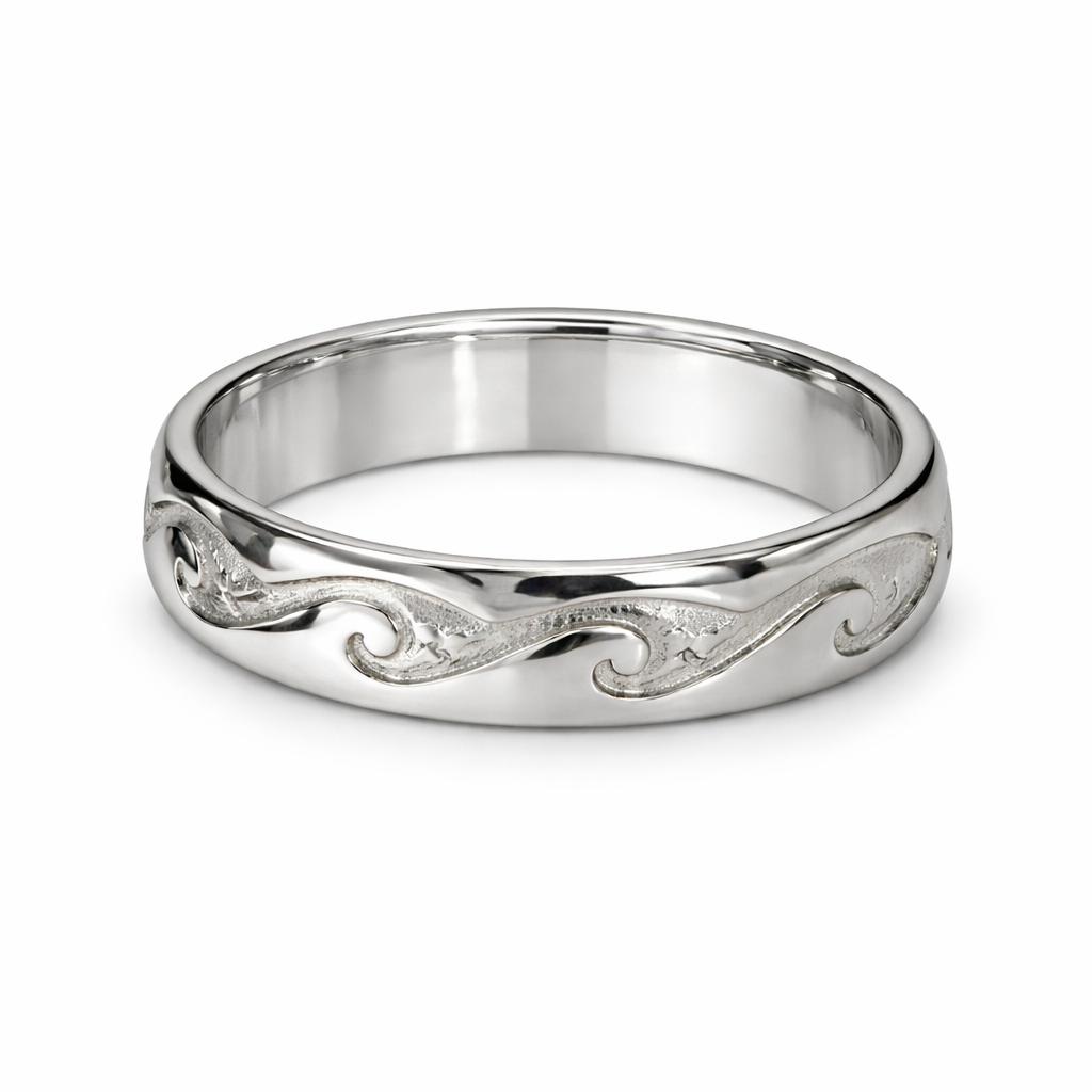Silver ring with intricate design on a white background