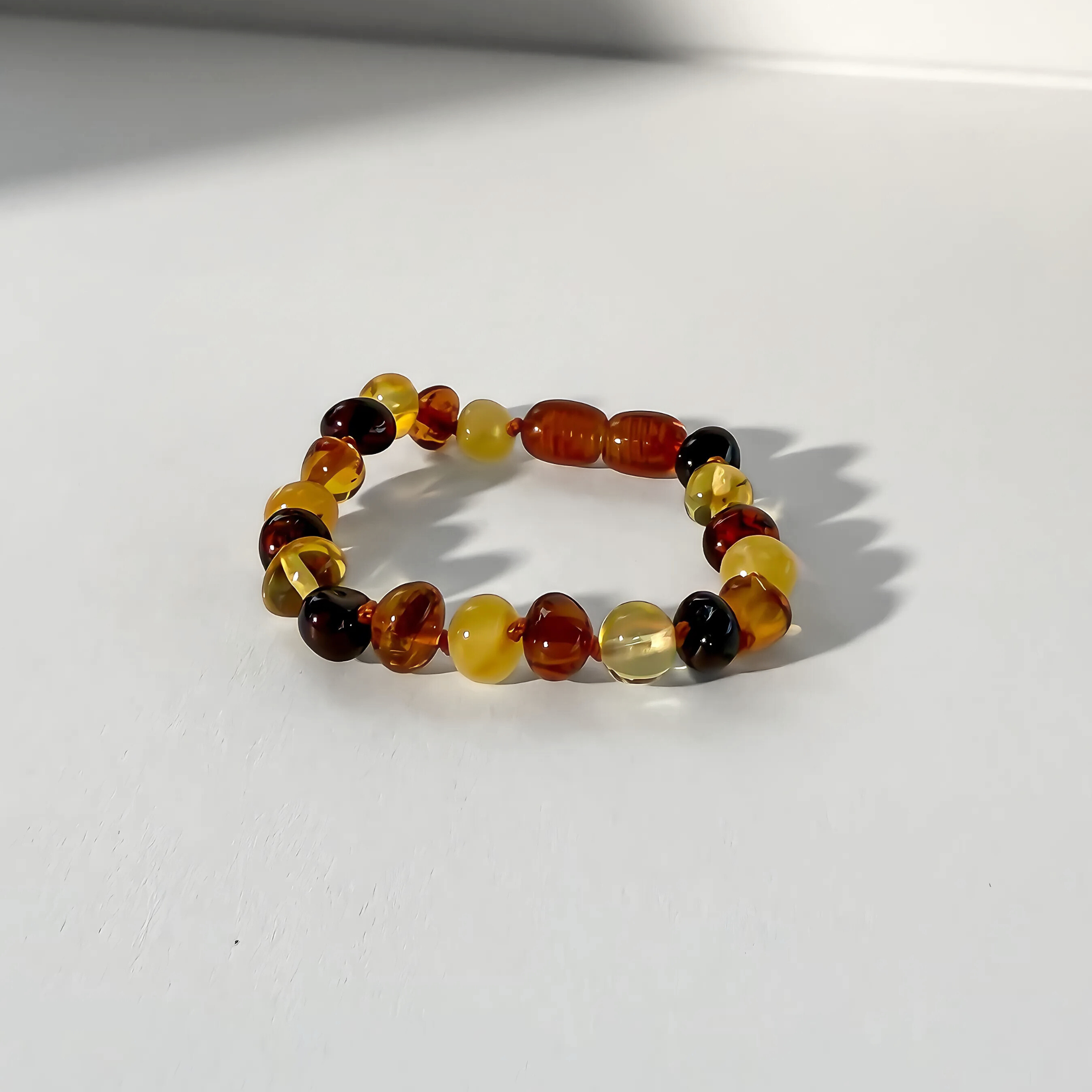 Multicolored beaded bracelet on a white background