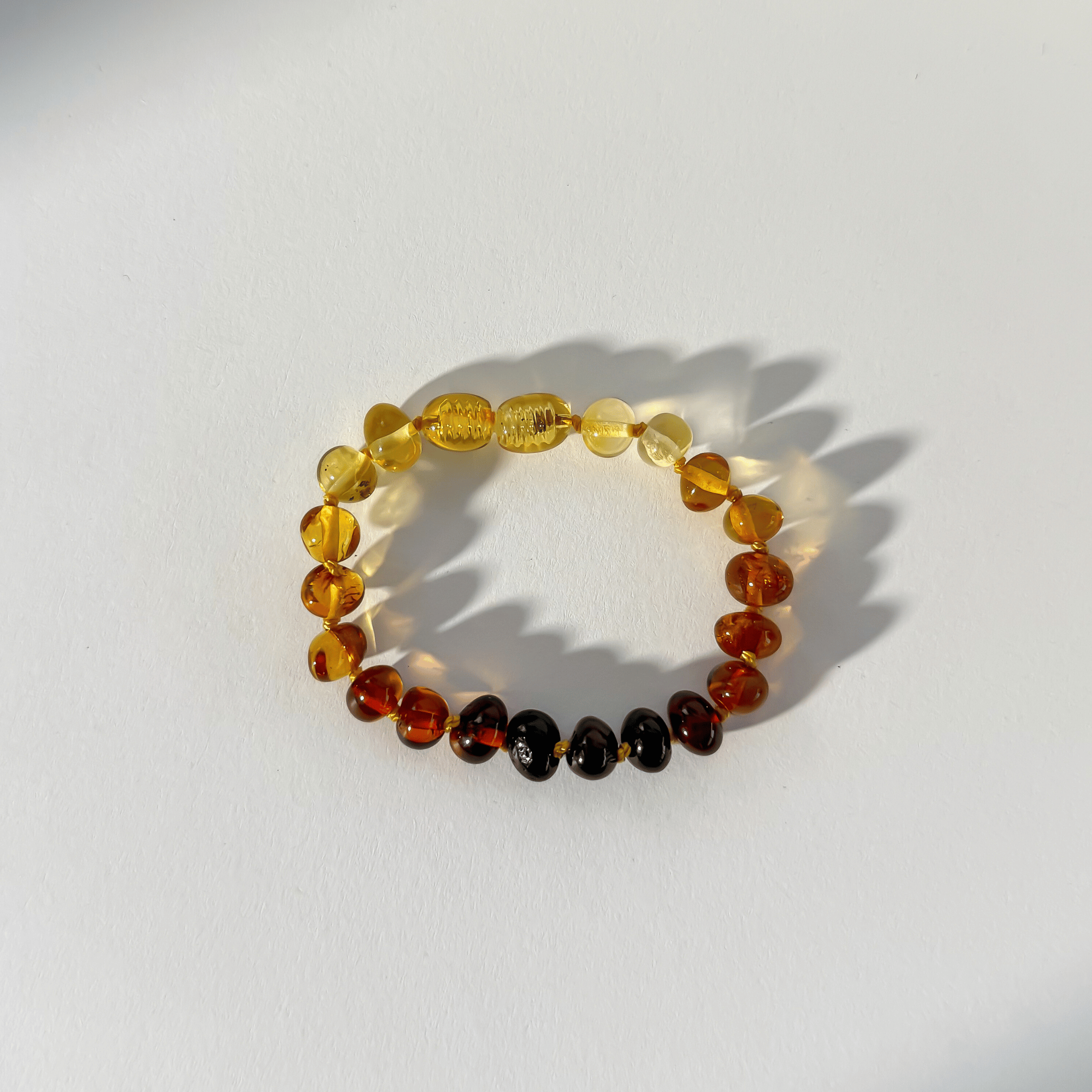 Multicolored beaded bracelet on a white background