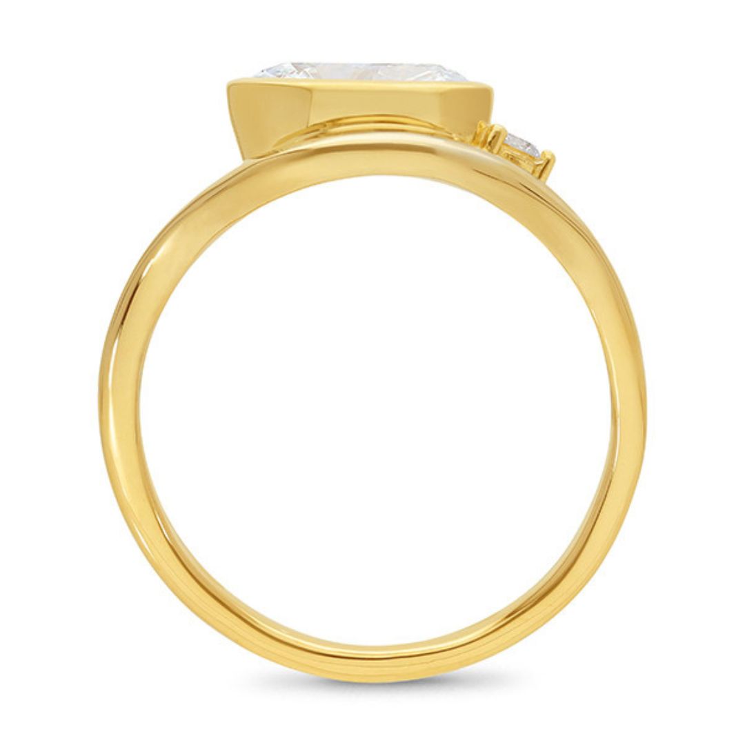 Gold ring with a diamond on a white background