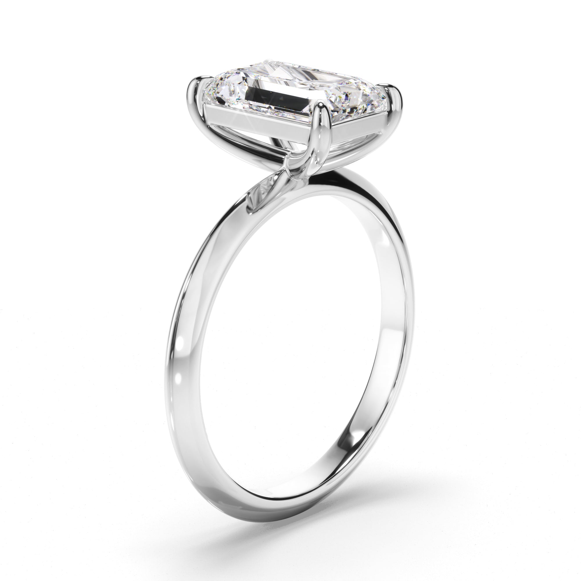 Diamond ring with a pear-shaped center stone on a white background