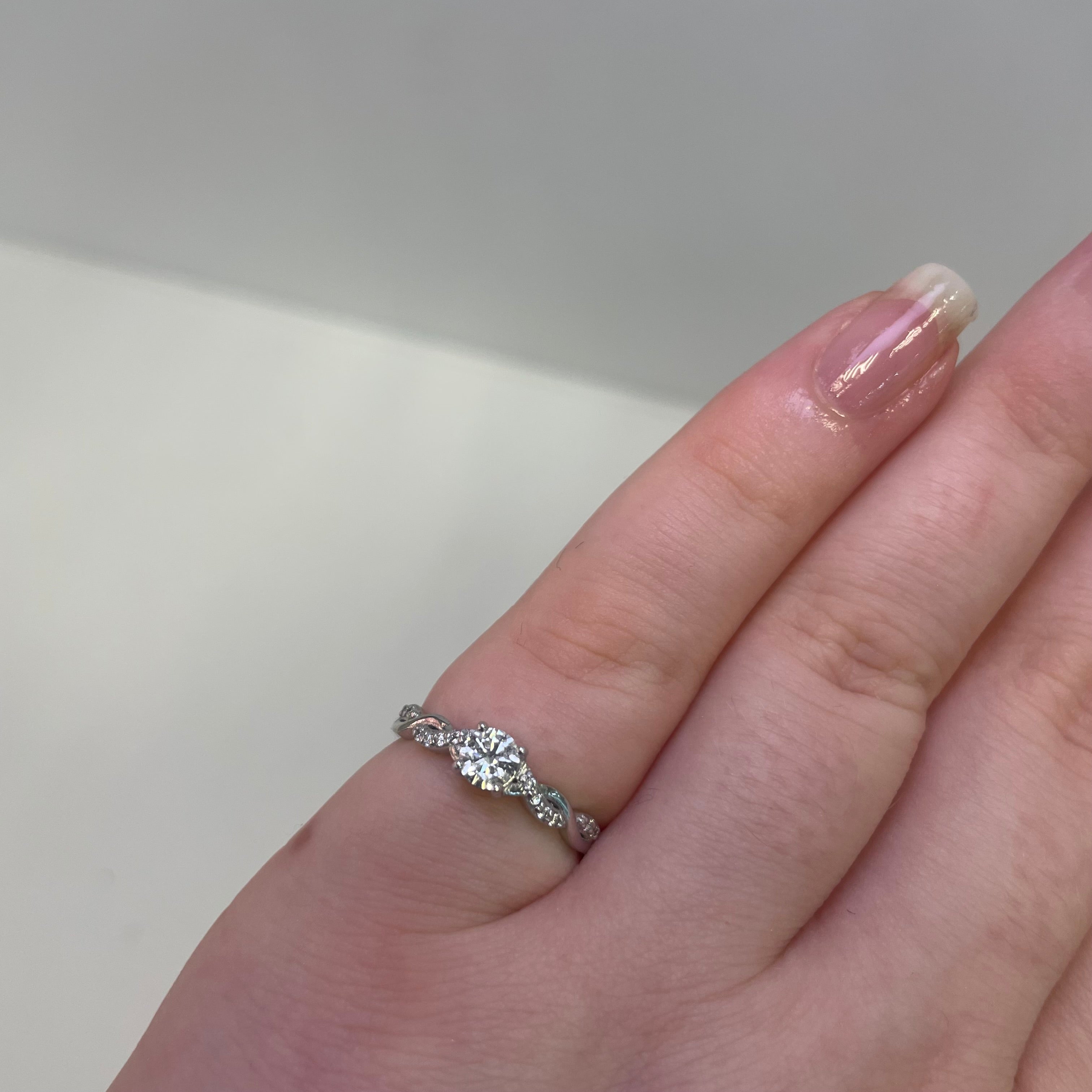 Ella Platinum Round Diamond Engagement Ring with Twist Diamond Shoulders (Size J 1/2)