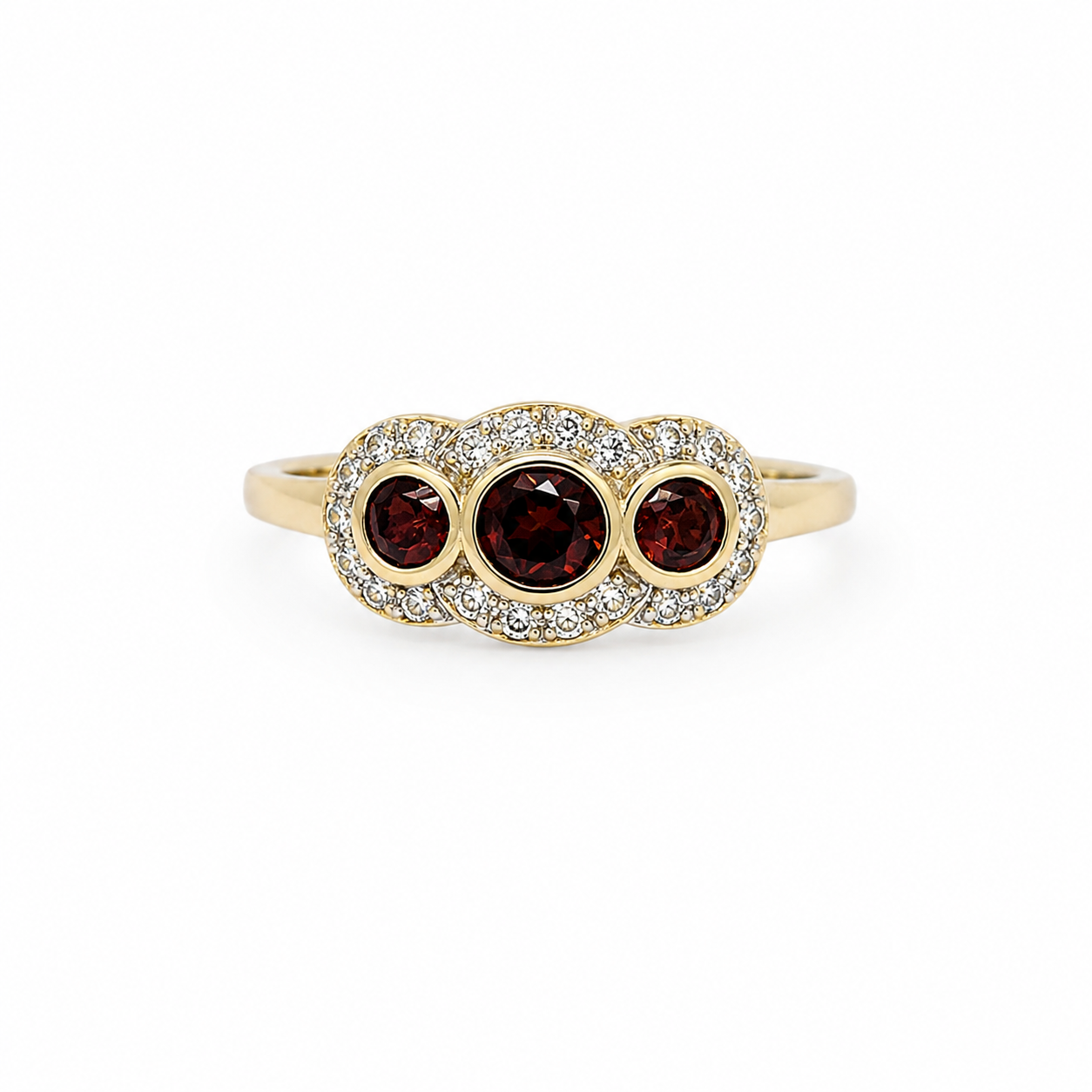 Gold ring with three red gemstones on a white background