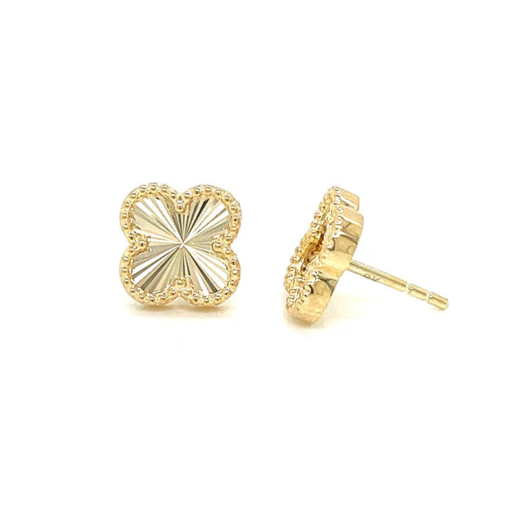 Gold earrings on a white background