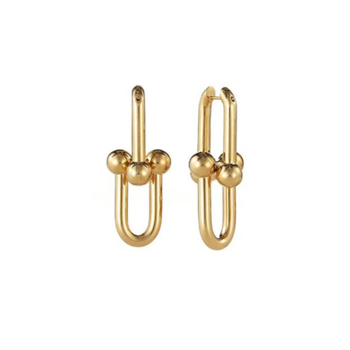 Pair of gold hoop earrings on a white background