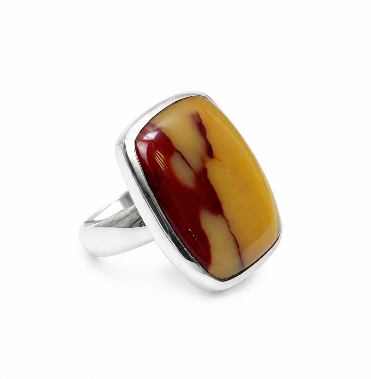 Ring with a large, rectangular, multicolored stone on a white background
