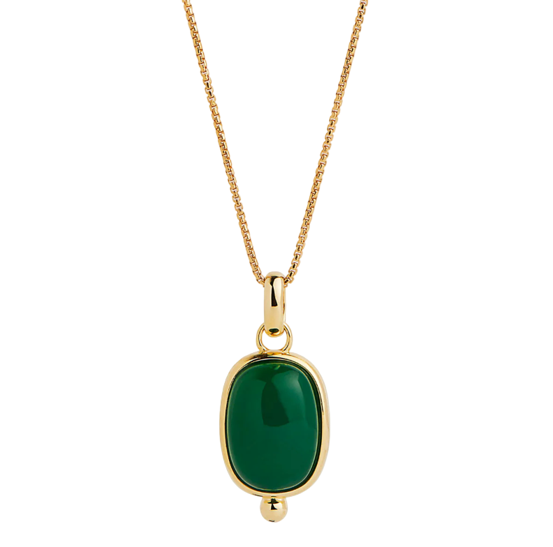 Gold necklace with a green pendant on a white background