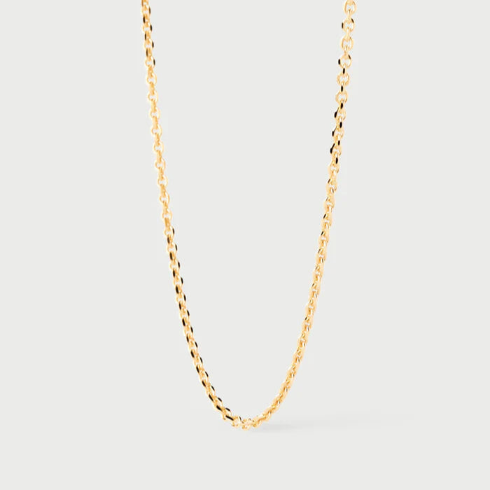 Gold chain necklace on a light gray background