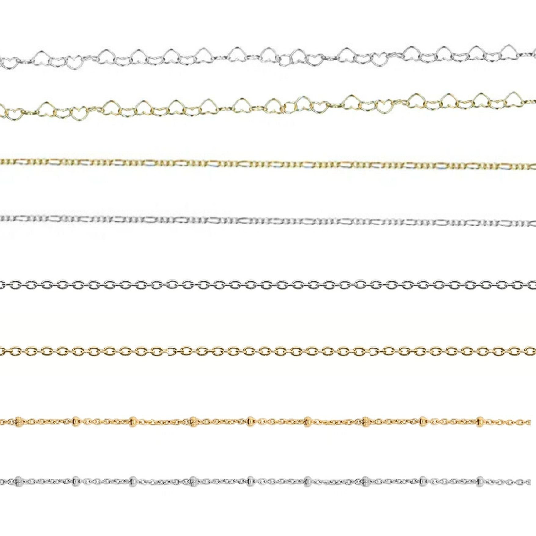 Set of gold, silver, and rose gold chain necklaces on a white background