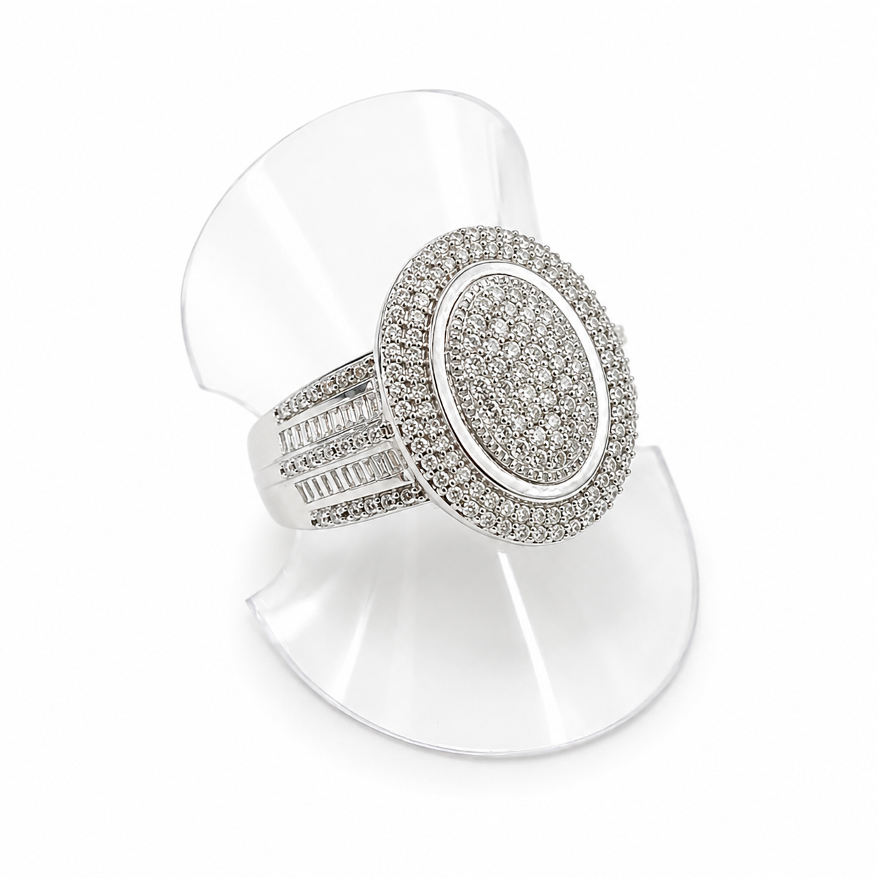 Silver ring with gemstones on a white stand