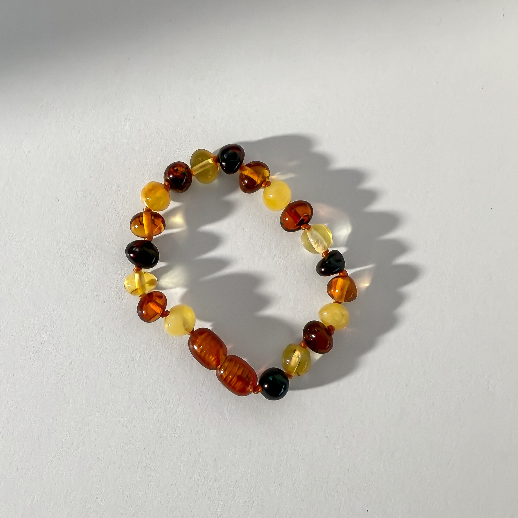 Multicolored beaded bracelet on a white background