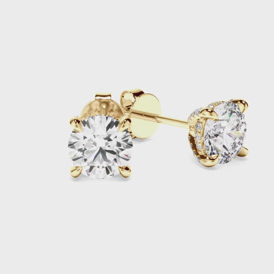Gold diamond stud earrings with small diamonds in the setting