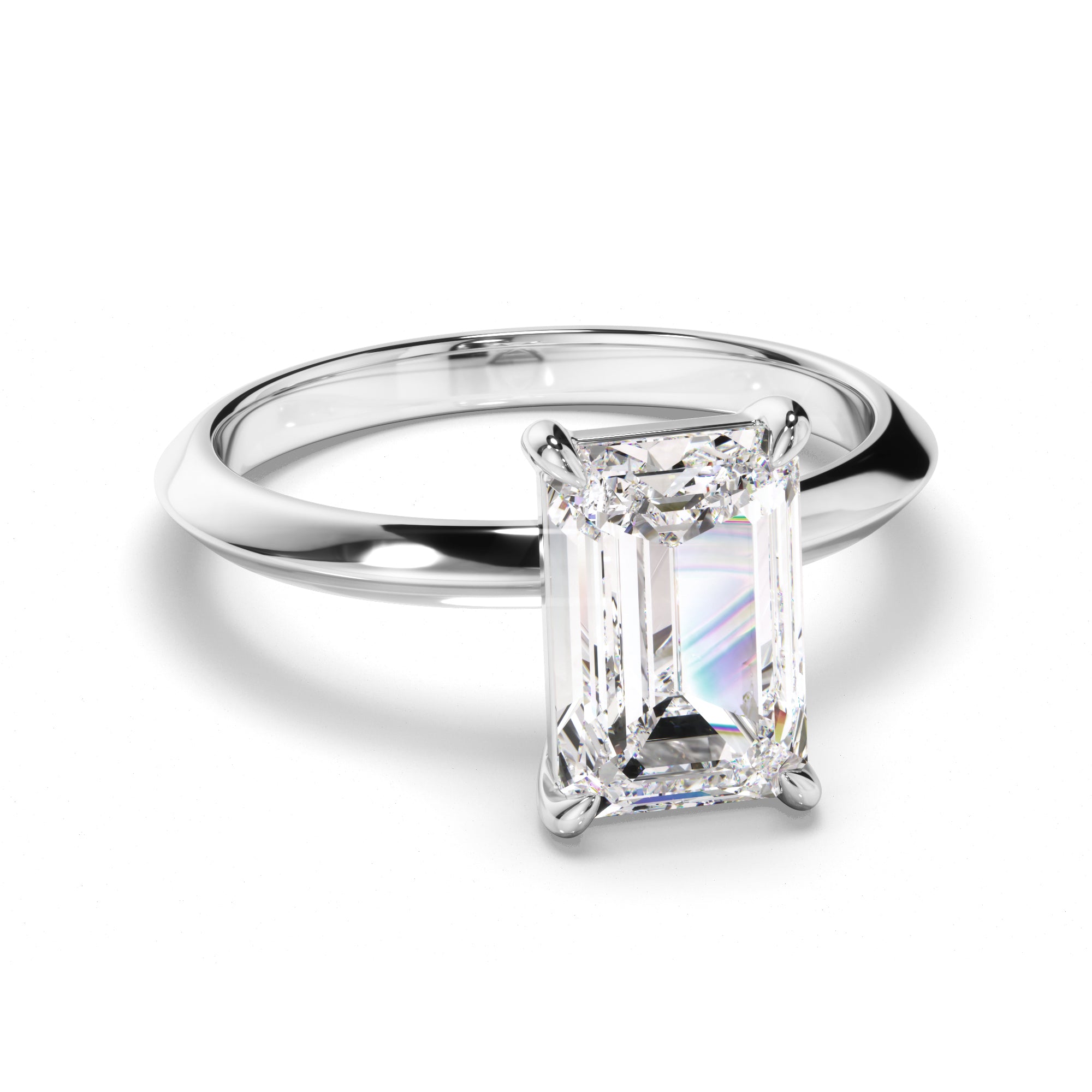 Diamond ring with emerald-cut diamond on a white background
