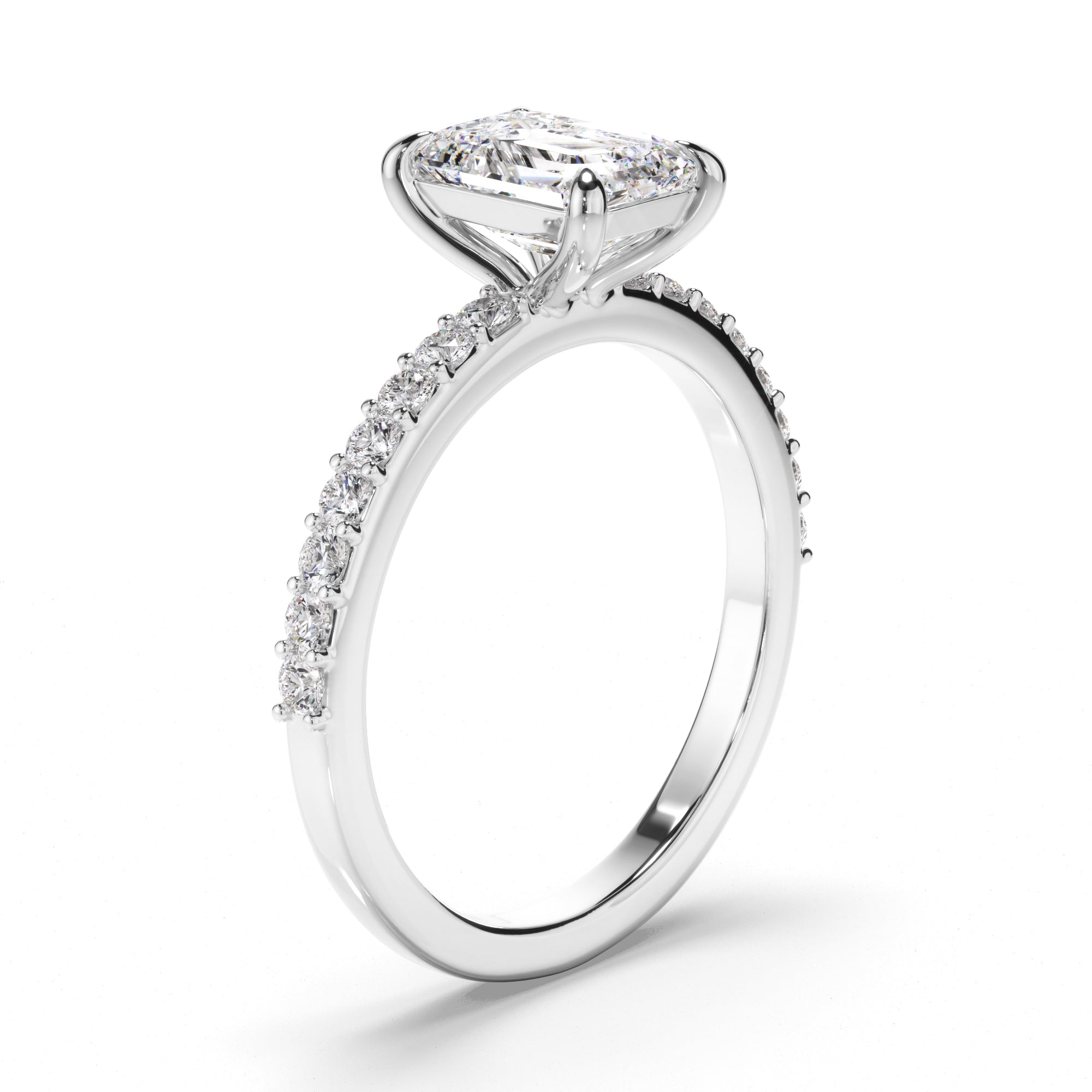 Diamond ring with a rectangular center stone on a white background